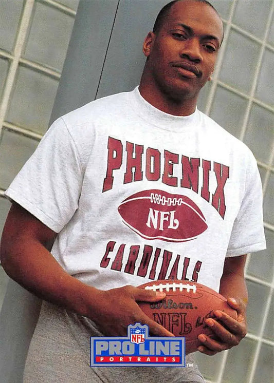 White t-shirt featuring Tim McDonald and Phoenix Cardinals NFL branding with football graphic