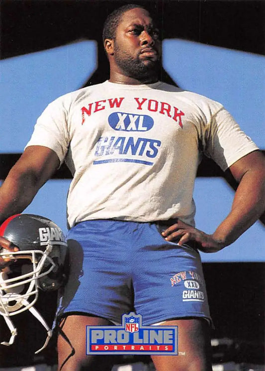 Football player in New York Giants gear beside a helmet, showcasing William Roberts Pro Line Portraits