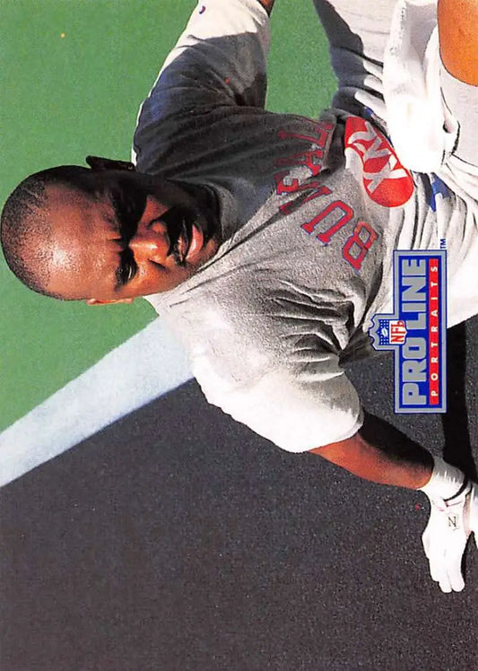 Baseball player in gray Boston Red Sox uniform near Thurman Thomas Buffalo Bills card