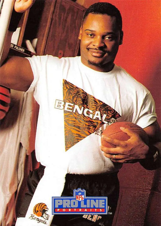 Football player in a Bengals tee holding a football, 1991 Ickey Woods Football Card
