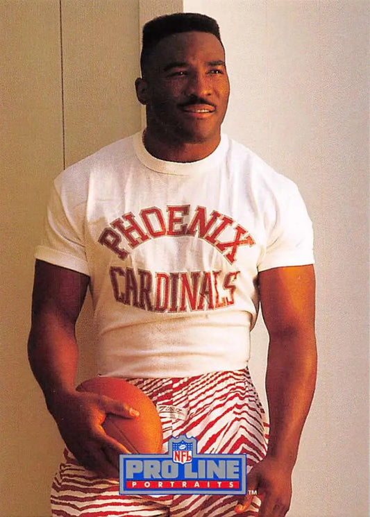 Person in white Phoenix Cardinals shirt holding football, featuring Anthony Thompson