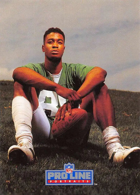Rob Moore in a green jersey with a football from Pro Line Portraits football card