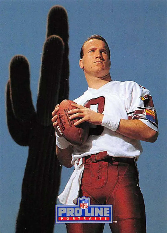 Timm Rosenbach in a white jersey with a football against a cactus background