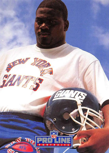 NFL player Pepper Johnson in New York Giants uniform holding helmet for Pro Line Portraits card