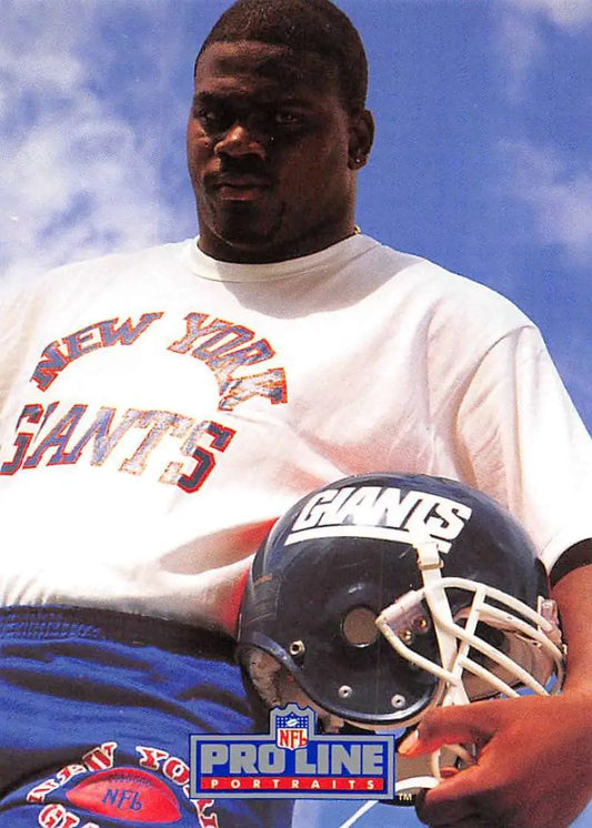 NFL player Pepper Johnson in New York Giants uniform holding helmet for Pro Line Portraits card