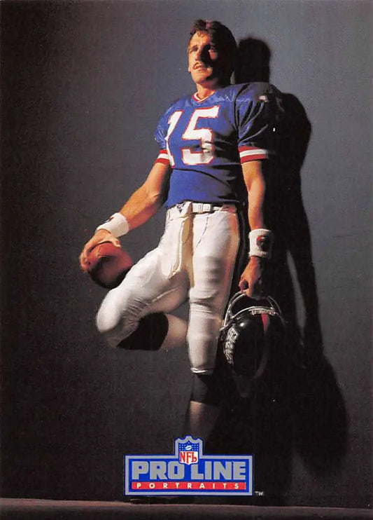 Jeff Hostetler in blue #15 jersey holding a helmet and football for New York Giants card