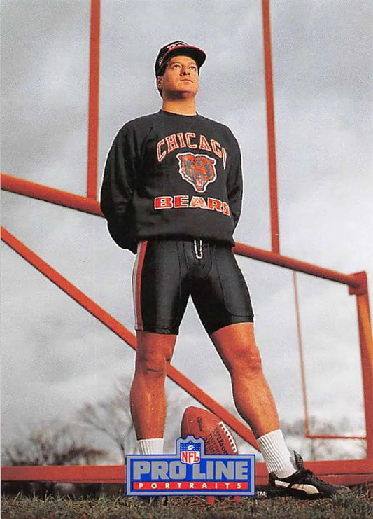 Person in Chicago Bears gear with football showcasing Kevin Butler Pro Line Portraits card
