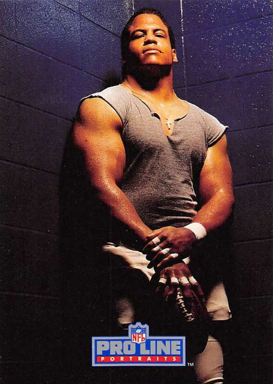 Muscular athlete in gray sleeveless shirt featured in Pro Line Portraits NFL card