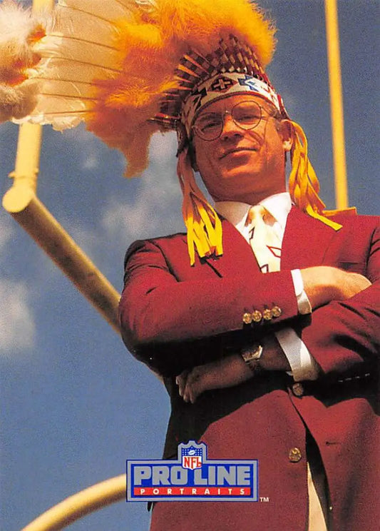 A person in a red marching band uniform with a feathered headdress on a football card