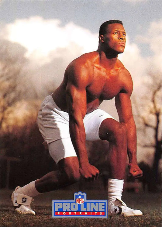 Muscular athlete in crouching stance with NFL ProLine logo on 1991 Michael Cofer football card