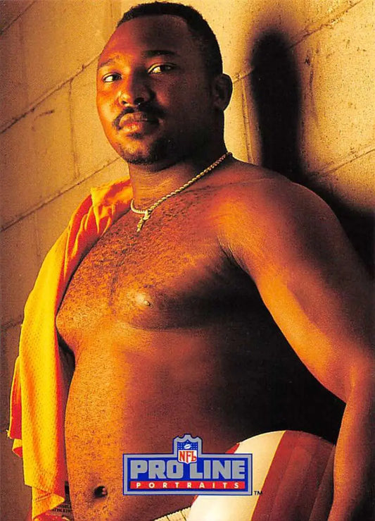Shirtless Keith McCants poses for NFL ProLine photo, showcasing Tampa Bay Buccaneers pride