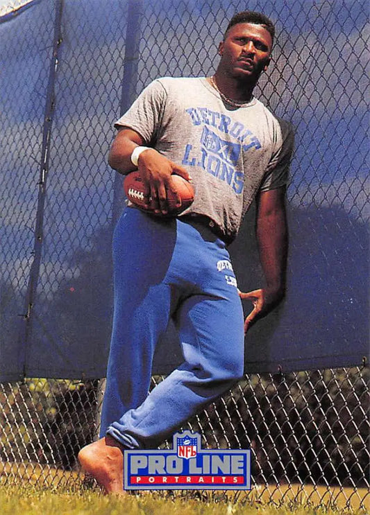 Football player in Detroit Lions gear holding a football, featuring Bennie Blades