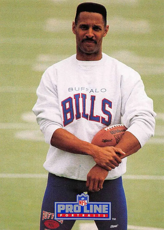 Football player in Buffalo Bills sweatshirt holding football, featuring James Lofton