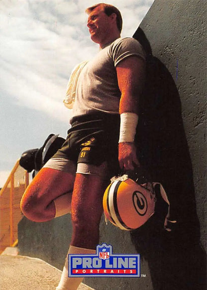 NFL Pro Line promotional photo of Brian Noble with a Green Bay Packers helmet