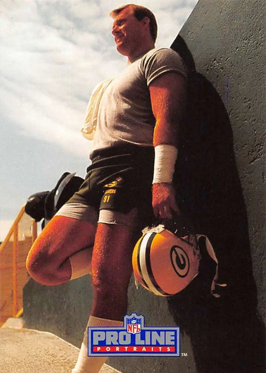 NFL Pro Line promotional photo of Brian Noble with a Green Bay Packers helmet