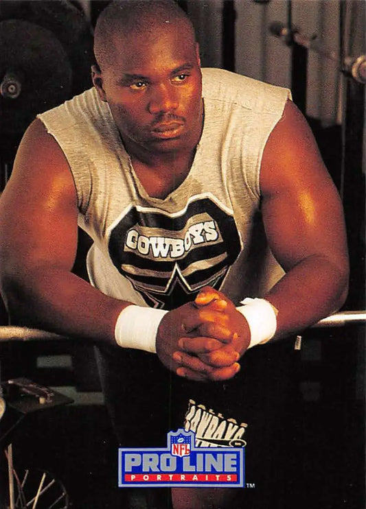 Athlete in Dallas Cowboys shirt with wristbands near Russell Maryland Pro Line Portraits card