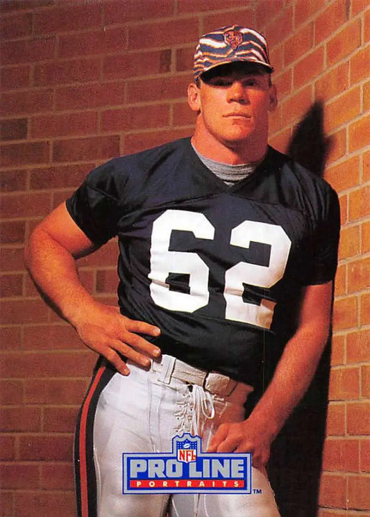 Football player in black jersey 62 with American flag cap on Mark Bortz football card