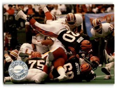 Football players in a pile from 1991 Pro Set Platinum Craig Taylor Cincinnati Bengals