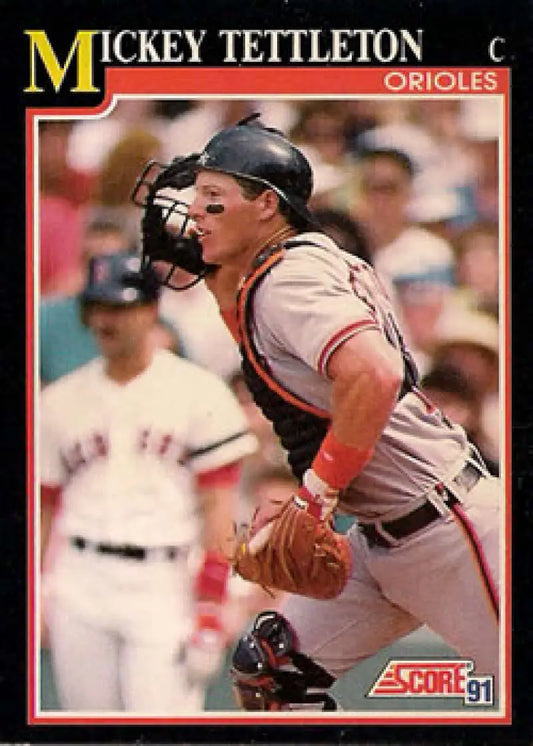 Baseball card of Mickey Tettleton catching for the Baltimore Orioles in action