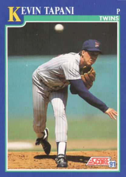 Minnesota Twins player Kevin Tapani mid-pitch delivery on baseball card