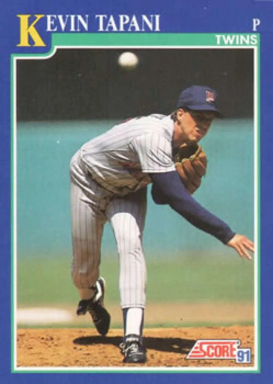 Minnesota Twins player Kevin Tapani mid-pitch delivery on baseball card
