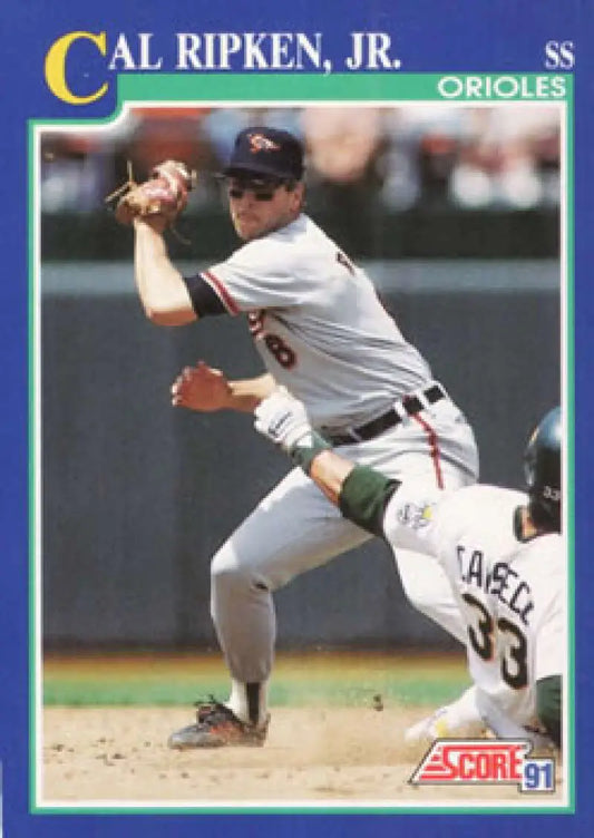 1991 Score Cal Ripken Jr. baseball card of Baltimore Orioles shortstop turning double play