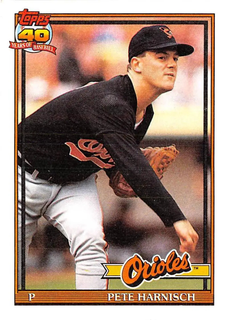 Baseball card of Pete Harnisch in black uniform for Baltimore Orioles mid-delivery