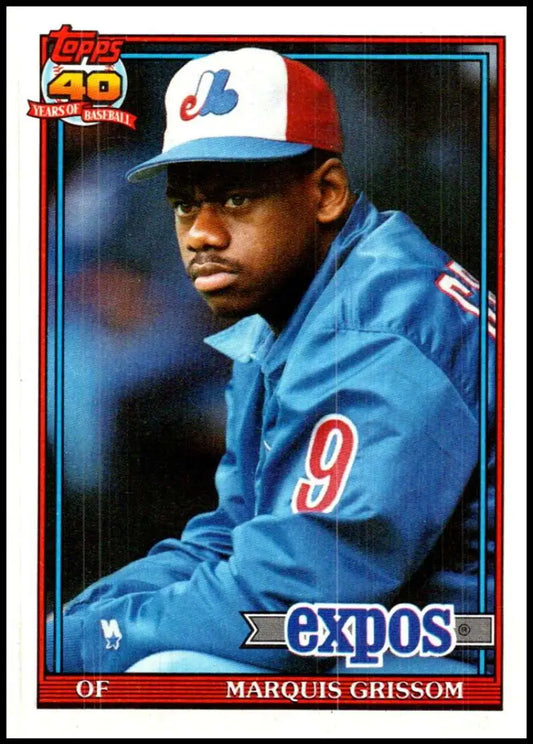 Marquis Grissom in red and white cap, blue jacket on Montreal Expos baseball card