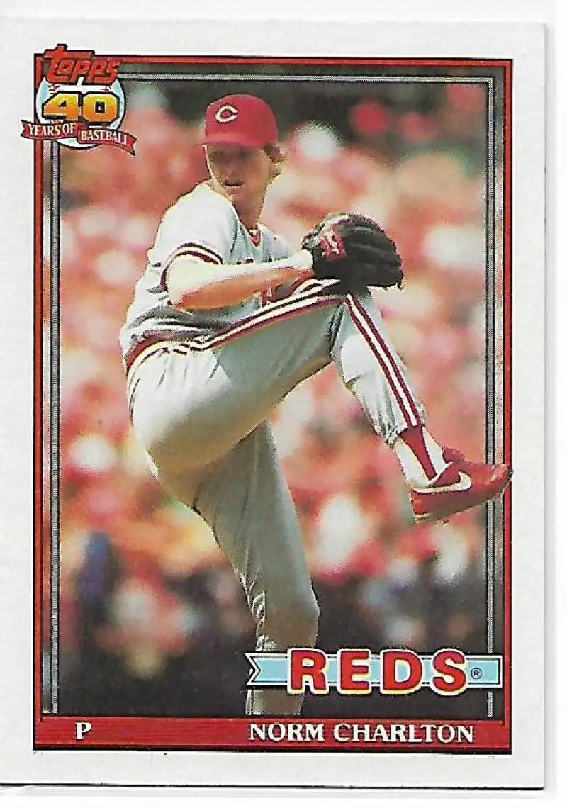 1991 Topps Norm Charlton baseball card featuring Cincinnati Reds pitcher mid-delivery