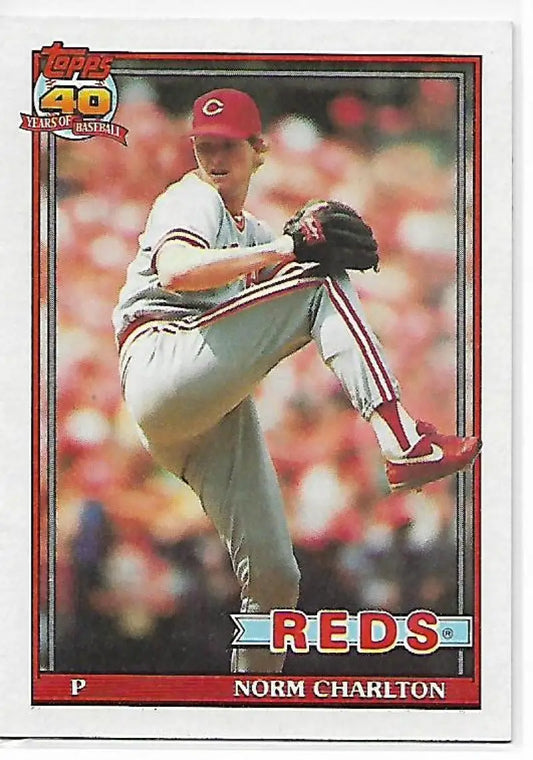 1991 Topps Norm Charlton baseball card featuring Cincinnati Reds pitcher mid-delivery