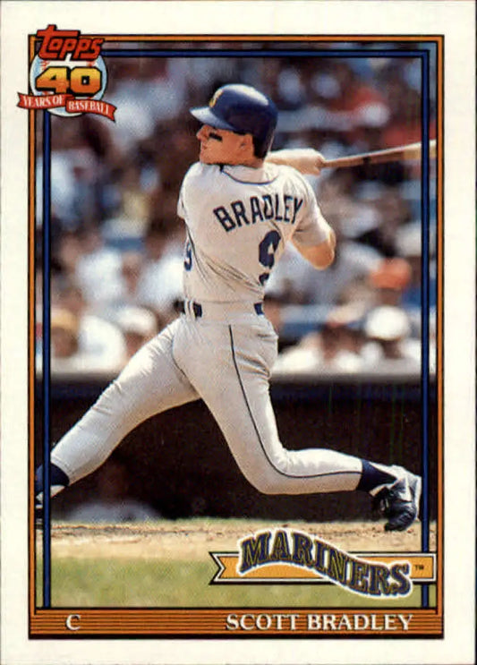 Baseball card of Scott Bradley in a white uniform for Seattle Mariners mid-swing