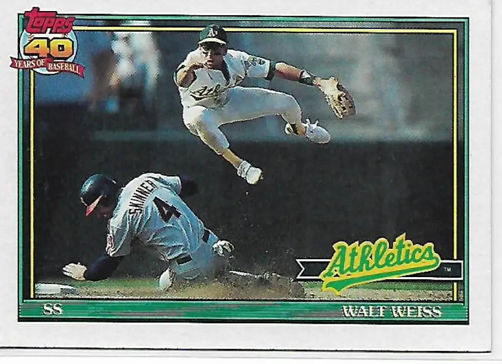 Walt Weiss leaps over a baserunner in the 1991 Topps Oakland Athletics Baseball Card