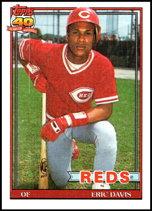 Vintage 1991 Topps baseball card of Eric Davis in Cincinnati Reds red uniform