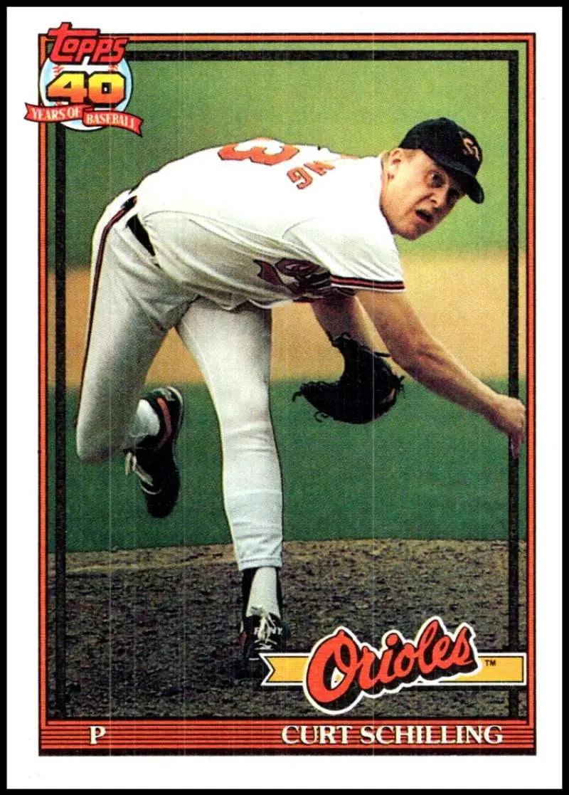 Curt Schilling mid-delivery in white uniform on Orioles baseball card 1991 Topps #569