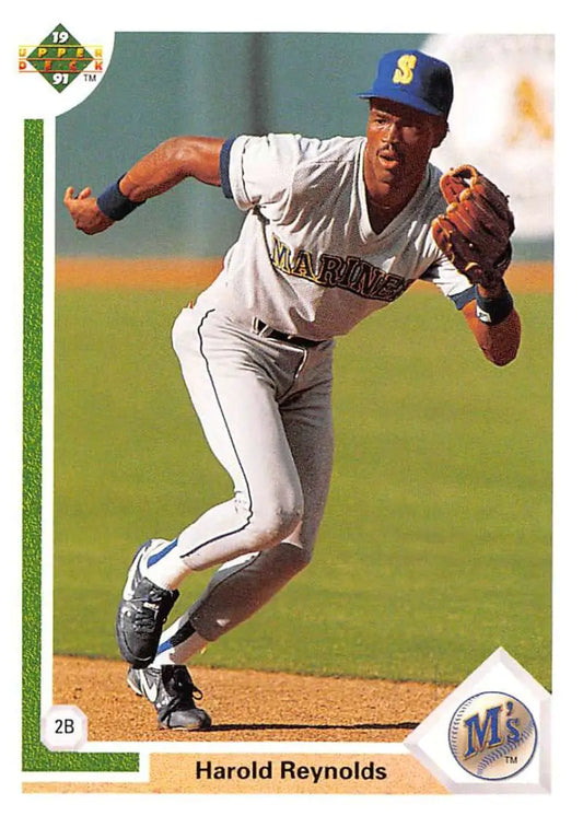 Baseball player Harold Reynolds fielding a ground ball in Seattle Mariners uniform