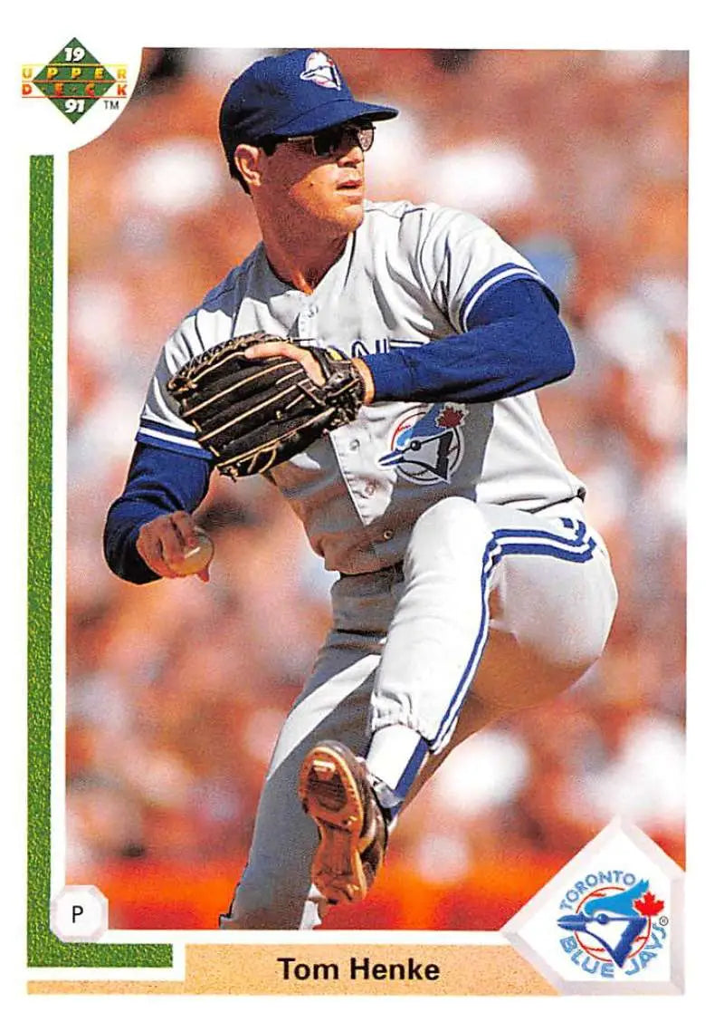 Baseball player Tom Henke pitching in Toronto Blue Jays uniform for Upper Deck card