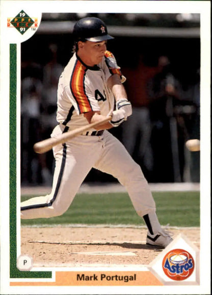 Baseball player Mark Portugal swinging bat in Houston Astros uniform baseball card