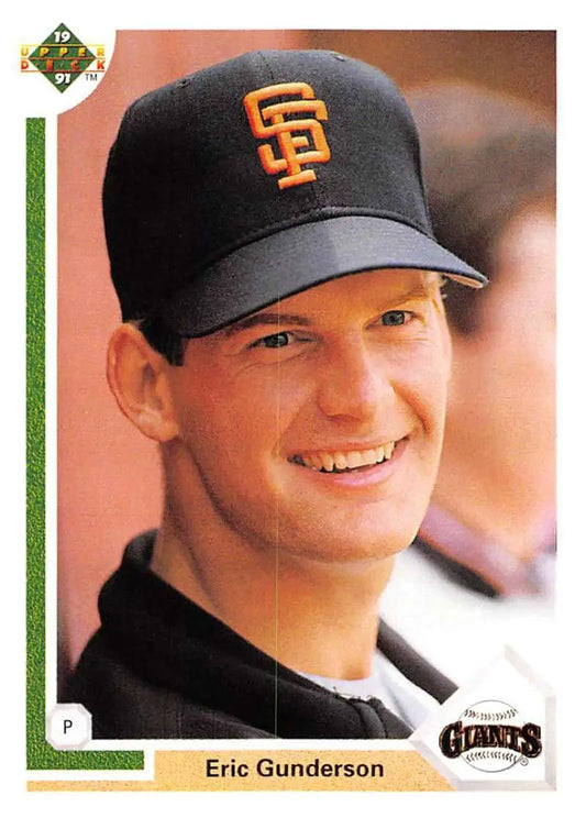 Baseball player Eric Gunderson smiling in San Francisco Giants cap on card
