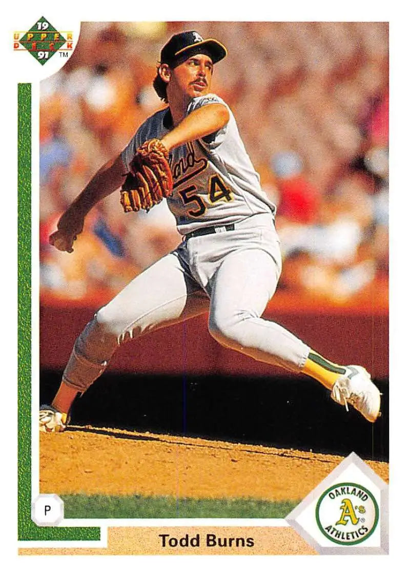 Baseball player Todd Burns mid-pitch in Oakland Athletics uniform for Upper Deck card