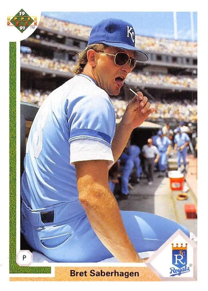 Kansas City Royals player Bret Saberhagen eating in dugout on 1991 baseball card