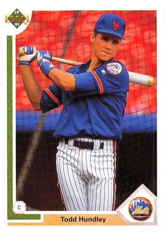 Todd Hundley in New York Mets uniform holding bat during practice for baseball card