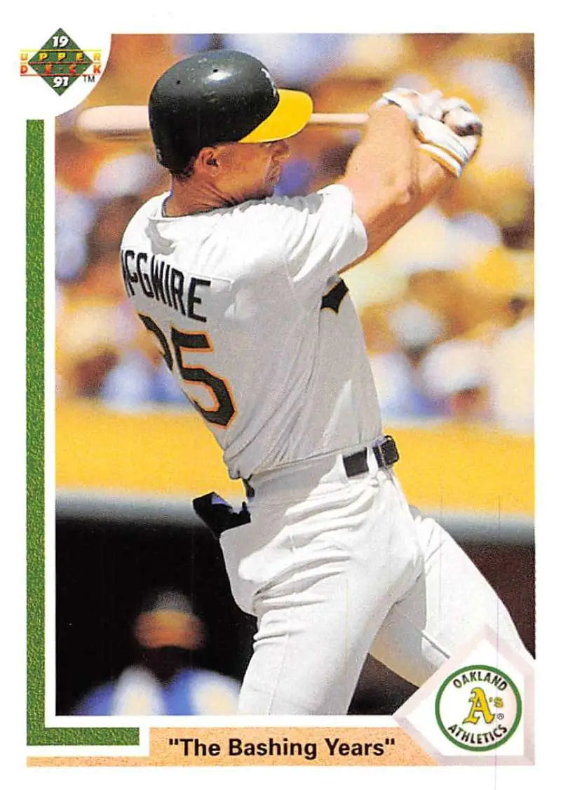 Mark McGwire swinging a bat in white Oakland Athletics uniform for Upper Deck card