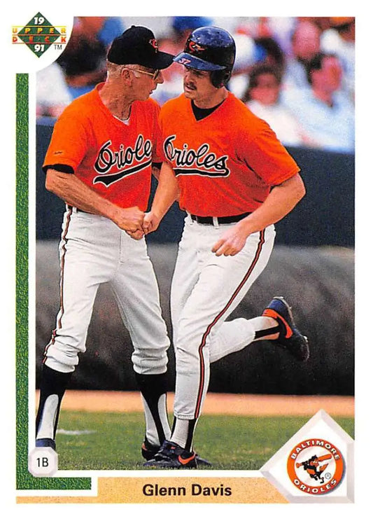 Baseball card of Glenn Davis and Baltimore Orioles players conversing on the field