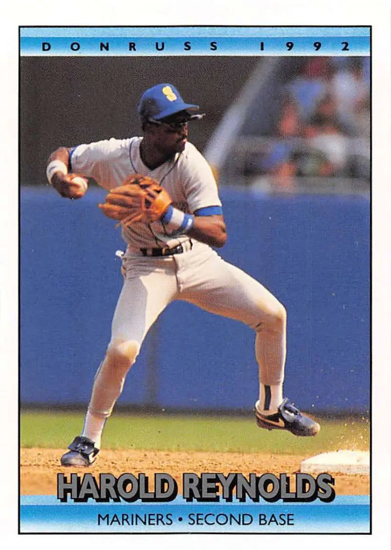 1992 Donruss #239 Harold Reynolds fielding a ground ball for Seattle Mariners baseball card