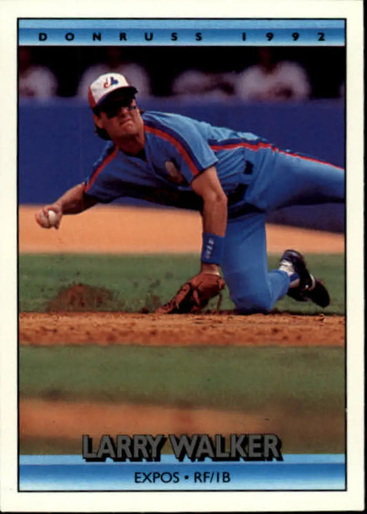 Larry Walker diving to field a ground ball in Montreal Expos uniform on a baseball card