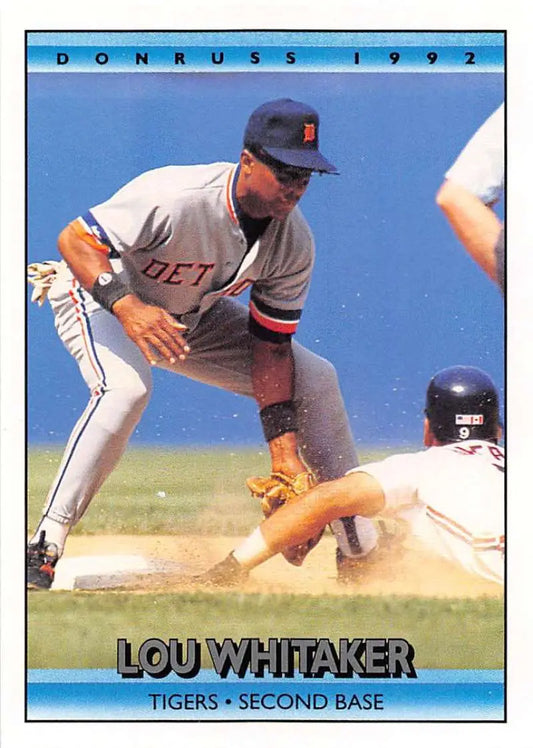 Baseball player Lou Whitaker in Detroit Tigers uniform tagging at second base
