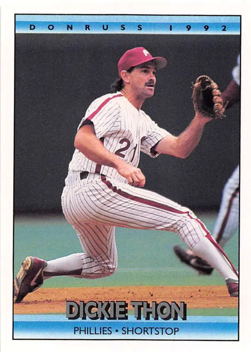 Dickie Thon fielding in a pinstriped uniform on a Philadelphia Phillies baseball card
