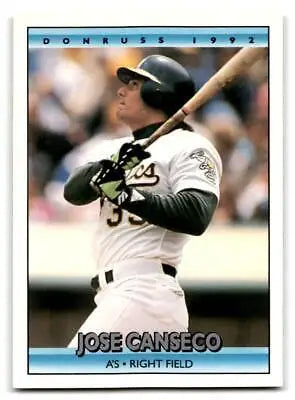 1992 Donruss #548b Jose Canseco baseball card featuring Oakland Athletics player at bat