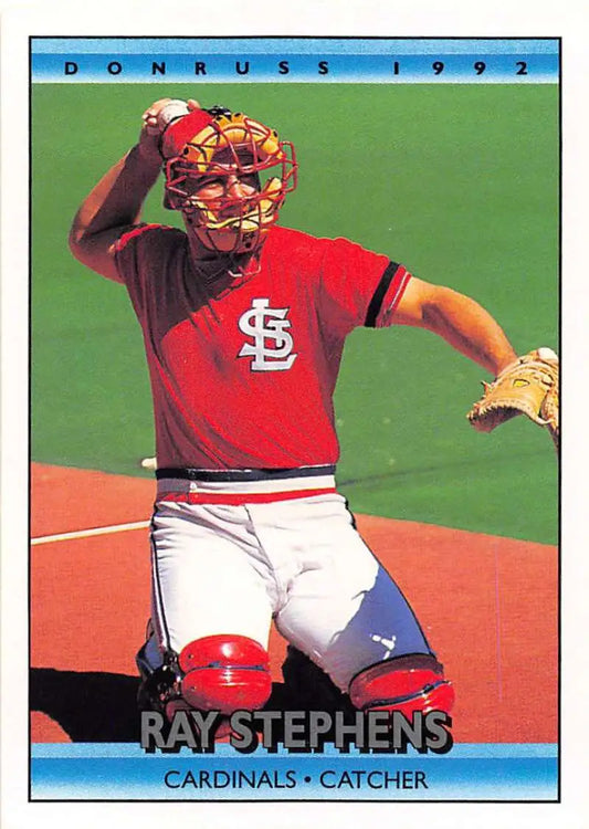 Ray Stephens catching for the St. Louis Cardinals in vibrant red uniform and gear