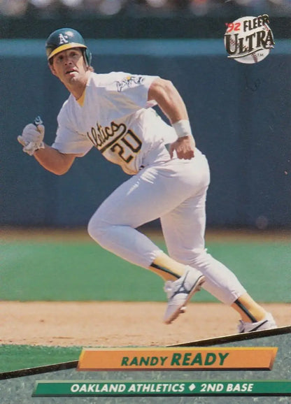 Randy Ready of the Oakland Athletics running on the field, featured in a baseball card